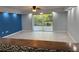 Bright living room with tiled floors, ceiling fan, and sliding glass doors at 3606 Beneva Rd # 502, Sarasota, FL 34232