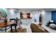 Spacious living room features a kitchen with modern appliances and tile floors at 3606 Beneva Rd # 502, Sarasota, FL 34232