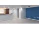 Living area with tiled floors, an accent wall, and a kitchen pass-through at 3606 Beneva Rd # 502, Sarasota, FL 34232