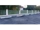Guest parking area with designated spaces and green wall at 3606 Beneva Rd # 502, Sarasota, FL 34232
