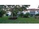 Landscaped yard with lush greenery and mature trees at 3606 Beneva Rd # 502, Sarasota, FL 34232