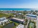 Condo complex near beach and waterway; tennis court nearby at 3801 E Bay Dr # 209, Holmes Beach, FL 34217