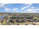 Aerial view of waterfront community featuring multiple buildings and boat docks at 3920 Bal Harbor Blvd # E1, Punta Gorda, FL 33950