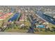 Aerial view of a canal-front community with lush landscaping and a pool at 3920 Bal Harbor Blvd # E1, Punta Gorda, FL 33950