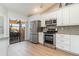 Modern kitchen with stainless steel appliances and granite counters at 3920 Bal Harbor Blvd # E1, Punta Gorda, FL 33950
