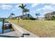 Private dock and lush green space next to a canal at 3920 Bal Harbor Blvd # E1, Punta Gorda, FL 33950