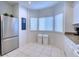 White kitchen with stainless steel refrigerator at 3980 Mediterranea Cir # 522, Sarasota, FL 34233