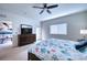 Main bedroom with dresser, TV, and access to balcony at 3980 Mediterranea Cir # 522, Sarasota, FL 34233