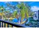 Community features a pond, walking path, lush landscaping, and mature trees at 435 30Th W Ave # D309, Bradenton, FL 34205