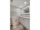 Bathroom with a vanity, toilet, and patterned rug at 435 30Th W Ave # D309, Bradenton, FL 34205