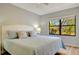 Bright bedroom with a king-size bed and view at 435 30Th W Ave # D309, Bradenton, FL 34205