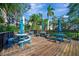 Community deck with shaded tables and benches at 435 30Th W Ave # D309, Bradenton, FL 34205