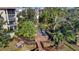 Community deck with tables, umbrellas, and tropical landscaping at 435 30Th W Ave # D309, Bradenton, FL 34205