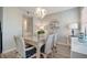 Charming dining room with wicker furniture and a glass-top table at 435 30Th W Ave # D309, Bradenton, FL 34205
