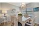 Bright dining room with a glass-top table and wicker chairs at 435 30Th W Ave # D309, Bradenton, FL 34205