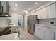 Modern kitchen with white cabinets and stainless steel appliances at 435 30Th W Ave # D309, Bradenton, FL 34205