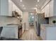 Modern kitchen with stainless steel appliances and white shaker cabinets at 435 30Th W Ave # D309, Bradenton, FL 34205