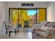 Living room with sliding doors leading to a private balcony at 435 30Th W Ave # D309, Bradenton, FL 34205