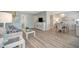 Bright living room featuring a comfortable sofa and dining area at 435 30Th W Ave # D309, Bradenton, FL 34205