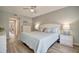 Spacious main bedroom with light blue bedding and white dresser at 435 30Th W Ave # D309, Bradenton, FL 34205
