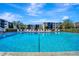 Inviting community pool with lounge chairs at 435 30Th W Ave # D309, Bradenton, FL 34205