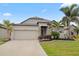 House exterior showcasing stone accents and landscaping at 4506 Lindever Ln, Palmetto, FL 34221