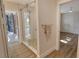 Bathroom with glass shower, patterned tile floor, and view of patio at 4584 Hidden River Rd, Sarasota, FL 34240