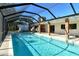 Inviting pool area with screened enclosure and spacious patio at 4584 Hidden River Rd, Sarasota, FL 34240