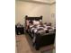 Bedroom with dark brown bed frame and carpet at 4802 51St W St # 1106, Bradenton, FL 34210