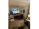 Dining room with table and chairs, adjacent to living room at 4802 51St W St # 1106, Bradenton, FL 34210