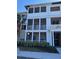 Three-story building exterior with balconies and landscaping at 4802 51St W St # 1106, Bradenton, FL 34210
