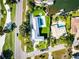 Aerial view of waterfront home with pool and lush landscaping at 501 Outrigger Ln, Longboat Key, FL 34228