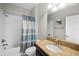 Clean bathroom with granite countertop and shower/tub combo at 5015 Jagged Cloud Dr, Wimauma, FL 33598