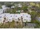 Aerial view showcasing condo community, pool, and surrounding landscape at 5128 Marsh Field Ln # 129, Sarasota, FL 34235