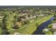 Aerial view of golf course community with homes and waterways at 5128 Marsh Field Ln # 129, Sarasota, FL 34235