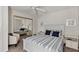 Serene bedroom with a king-size bed, ceiling fan, and ample closet space at 5128 Marsh Field Ln # 129, Sarasota, FL 34235