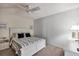 Cozy bedroom with a king-size bed, ceiling fan, and mirrored closet at 5128 Marsh Field Ln # 129, Sarasota, FL 34235