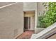 Private condo entry with brick walkway and lush greenery at 5128 Marsh Field Ln # 129, Sarasota, FL 34235
