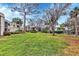 Well-maintained grassy yard with mature trees at 5128 Marsh Field Ln # 129, Sarasota, FL 34235