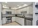 Modern kitchen featuring stainless steel appliances and ample cabinetry at 5128 Marsh Field Ln # 129, Sarasota, FL 34235