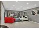 Living area with gray walls, white sectional sofa, and access to a patio at 5128 Marsh Field Ln # 129, Sarasota, FL 34235