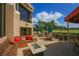 Relaxing patio area with seating, fire pit, and golf course views at 5128 Marsh Field Ln # 129, Sarasota, FL 34235