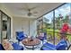 Bright screened-in patio with outdoor furniture at 5128 Marsh Field Ln # 129, Sarasota, FL 34235