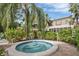 Relaxing community hot tub surrounded by tropical plants at 542 Lakeside Dr # 542, Bradenton, FL 34210