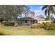 Backyard features a screened patio, perfect for outdoor enjoyment at 5839 Helicon Pl, Sarasota, FL 34238