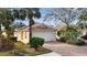Inviting curb appeal with a well maintained front yard and driveway at 5839 Helicon Pl, Sarasota, FL 34238