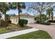 House exterior showcases a beautiful front yard and a two-car garage at 5839 Helicon Pl, Sarasota, FL 34238