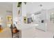 Well-equipped kitchen boasts white cabinets, stainless steel appliances, and breakfast bar at 5839 Helicon Pl, Sarasota, FL 34238