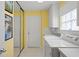 Laundry room with washer, dryer, and built-in cabinets at 5839 Helicon Pl, Sarasota, FL 34238