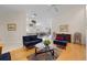 Open concept living room with view into adjacent kitchen and dining area at 5839 Helicon Pl, Sarasota, FL 34238